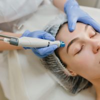 Closeup portrait of beautiful woman during cosmetology therapy in beauty salon. Professional dermatology procedures, lifting, rejuvenation, modern devices, healthcare